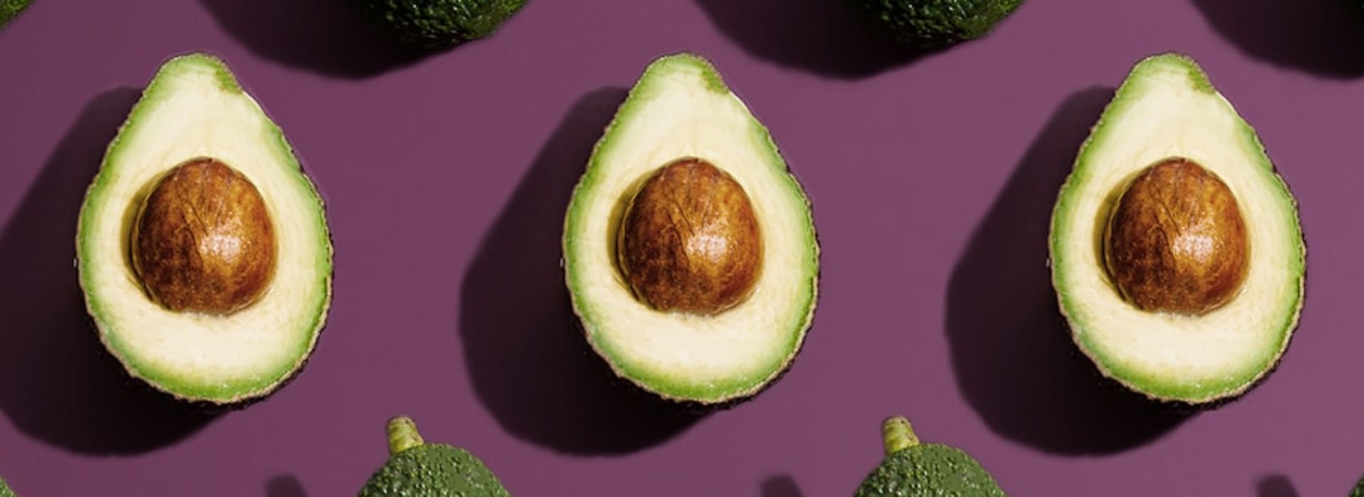sliced green fruit on purple background